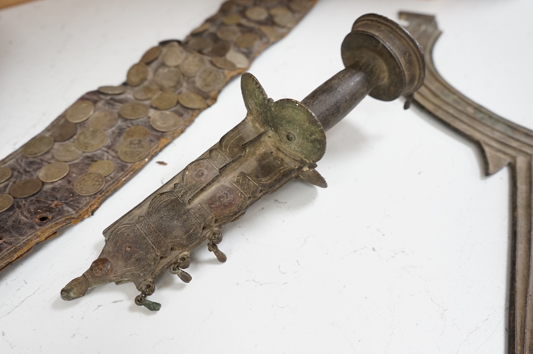 A 19th century Persian silver, niello work and coin mounted belt, dated 1880 (1297 AH in script) and an African sword (broken)